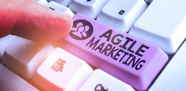 Writing note showing Agile Marketing. Business concept for focusing team efforts that deliver value to the endcustomer - Photo, Image