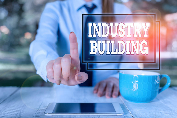 Writing note showing Industry Building. Business photo showcasing Factories and other premises used for analysis manufacturing Business woman sitting by the table with cup of coffee and mobile phone. - Photo, Image