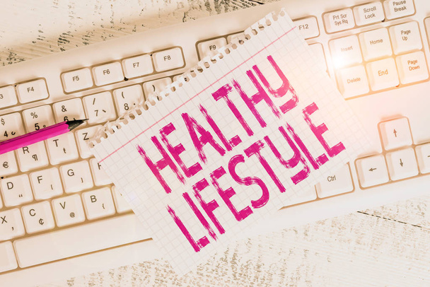 Writing note showing Healthy Lifestyle. Business concept for way of living that lowers the risk of being seriously ill Keyboard office supplies rectangle shape paper reminder wood - Photo, Image