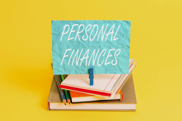 Word writing text Personal Finances. Business photo showcasing the activity of analysing own money and financial decisions Book pencil rectangle shaped reminder notebook clothespin office supplies - Photo, Image