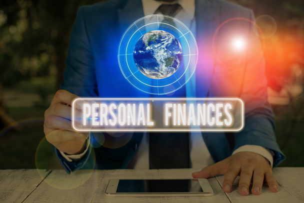Text sign showing Personal Finances. Conceptual photo the activity of analysing own money and financial decisions Elements of this image furnished by NASA. - Photo, Image