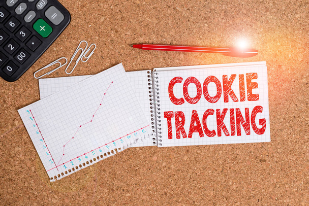 Написання тексту Cookie Tracking. Business photo showcasing Data stored in the user computer by website at Desk notebook paper cardboard study data table - Фото, зображення