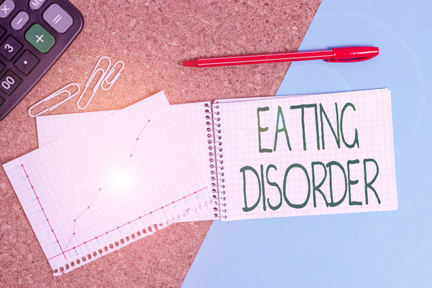 食生活障害を書く手書きテキスト。不規則な食生活が特徴の概念的な写真の病気デスクノートブックペーパーオフィス段ボール研究用品表チャート - 写真・画像