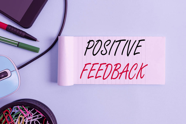 Conceptual hand writing showing Positive Feedback. Concept meaning good and great comments coming from satisfied customers Notebook and stationary with gadgets above pastel backdrop - 写真・画像