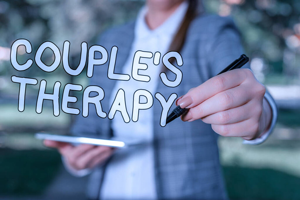Conceptual hand writing showing Couple S Therapy. Concept meaning treat relationship distress for individuals and couples Outdoor background business woman holding laptop and pen - Photo, Image