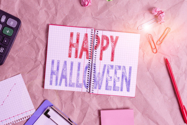 Handwriting text Happy Halloween. Conceptual photo evening before the Christian holy days of All Hallows Day Papercraft craft paper desk square spiral notebook office study supplies - Photo, Image