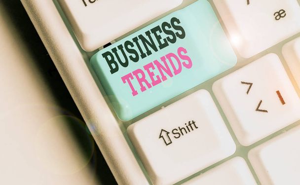 Writing note showing Business Trends. Business concept for a general change in the way business is developing - Photo, Image