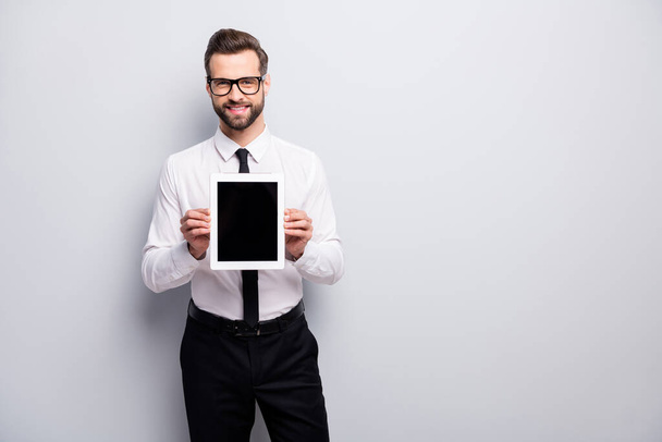 Portrait of confident cool boss collar marketer man hold tablet show screen demonstrate new start-up offer recommend white isolated over grey color background - 写真・画像