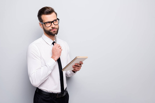 Photo of handsome business man writing corporate speech creative idea hand on chin look empty space dreamy wear specs office shirt pants tie isolated grey color background - Foto, immagini