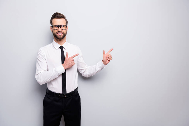 Photo of attractive business man professional indicate fingers look interested empty space advising novelty wear specs shirt pants tie isolated grey color background - Foto, imagen