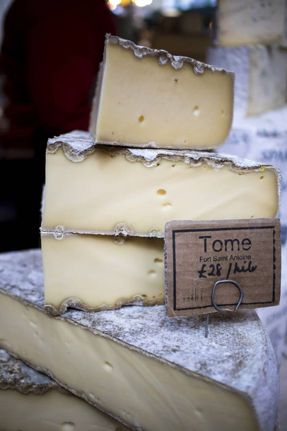 Various types of cheese on counter for sale at Borough Market - Foto, Imagen
