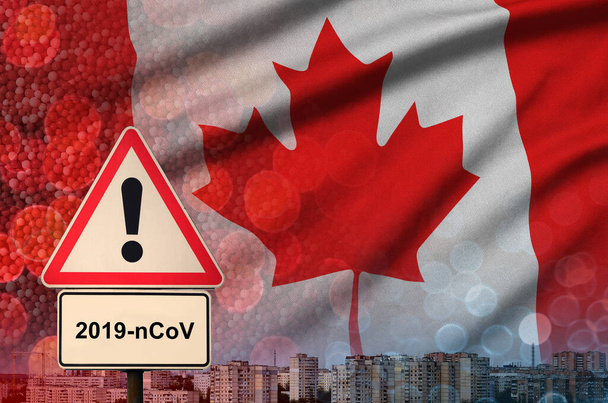 Σημαία Καναδά και Coronavirus 2019-ncov σήμα συναγερμού. Έννοια της υψηλής πιθανότητας νέων ξέσπασμα coronavirus μέσω ταξιδιωτικών τουριστών - Φωτογραφία, εικόνα