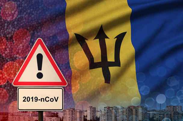 Barbados flag and Coronavirus 2019-nCoV alert sign. Concept of high probability of novel coronavirus outbreak through traveling tourists - Photo, Image