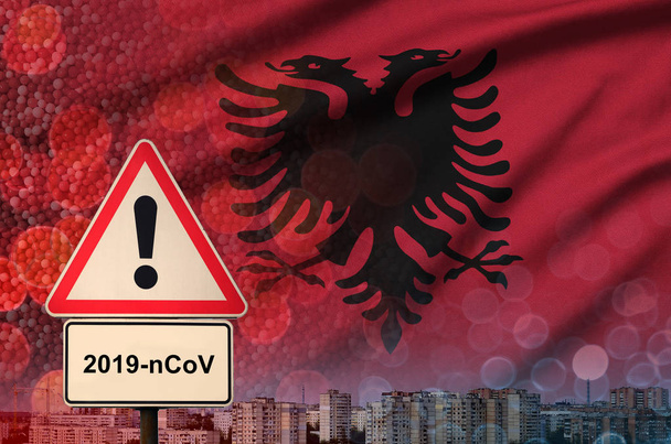 Флаг Албании и коронавирус 2019-nCoV тревожный знак. Концепция высокой вероятности возникновения новой вспышки коронавируса у путешествующих туристов
 - Фото, изображение