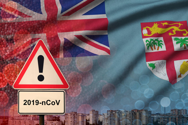 Bandera de Fiyi y señal de alerta Coronavirus 2019-nCoV. Concepto de alta probabilidad de brote novedoso de coronavirus a través de turistas viajeros
 - Foto, Imagen