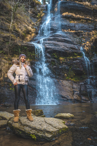 portrait of young woman near waterfall - Foto, immagini