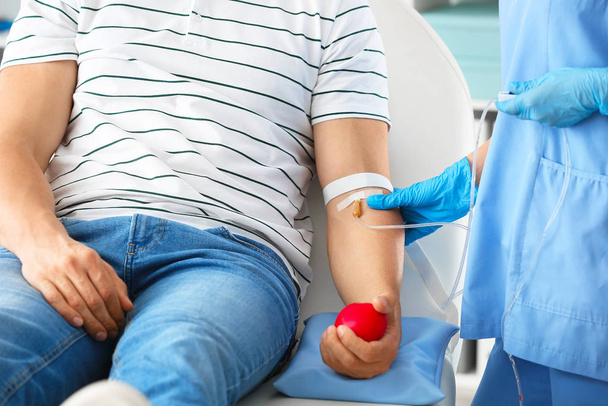 Man donating blood in hospital - Fotó, kép