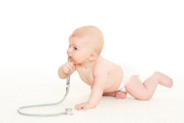 Sweet baby with stethoscope on a  white background. - Photo, image