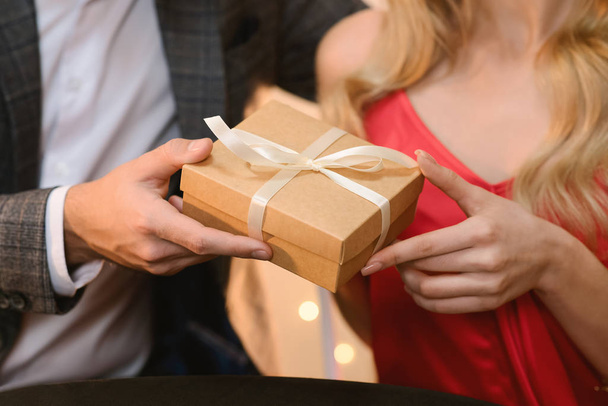 Closeup Of Unrecognizable Man Giving Present Box To His Beloved Woman - Фото, изображение