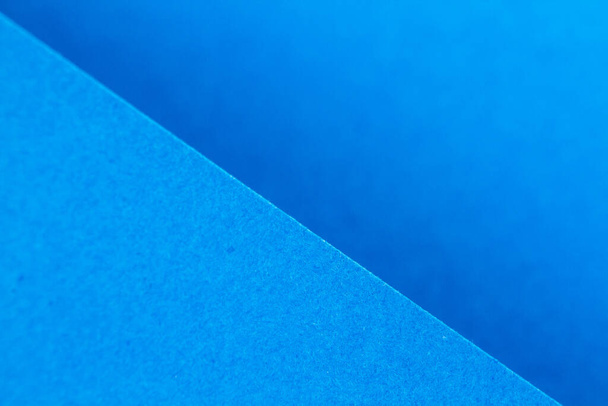 Vista cercana de los papeles de artesanía azul, se puede utilizar para origami
 - Foto, imagen