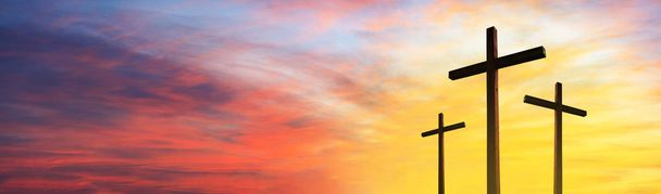 Cross of Jesus Christ empty over dramatic sunrise sky panorama w - Photo, Image