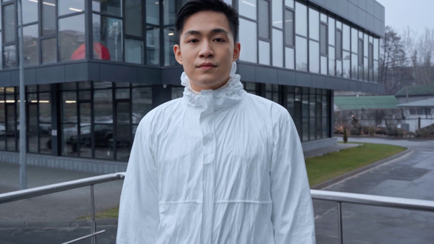 handsome asian scientist in protective suit  - Footage, Video