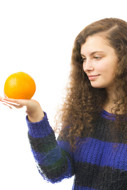 young pretty woman is holding an apple - Фото, зображення