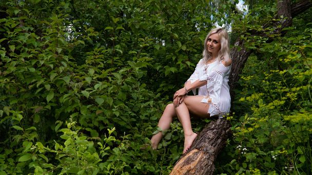 sexy blonde woman in summer dress at nature  - Photo, Image