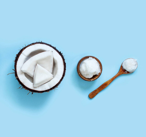 Coconut oil in a bowl with a spoon  - Photo, Image
