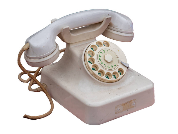 oude telefoon geïsoleerd op witte achtergrond - Foto, afbeelding