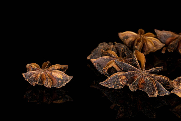 Badian star anise isolated on black glass - Foto, immagini
