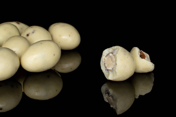 Stracciatella almond nut isolated on black glass - Фото, изображение