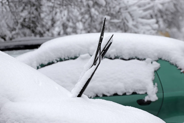 Cars covered with heavy snow in winter. Car wipers raised - Photo, Image