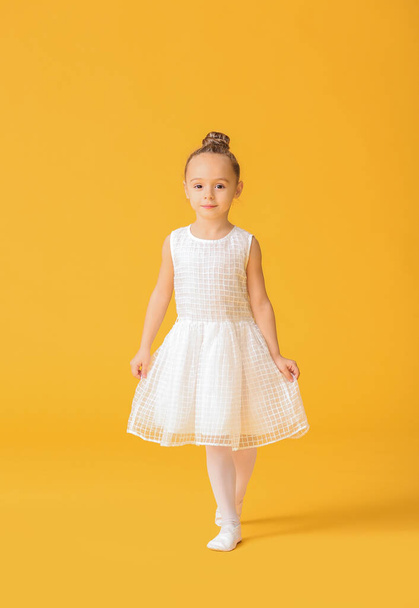 Cute little ballerina on color background - Photo, Image