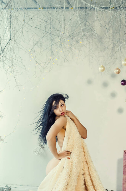 Beautiful Brunette on the Background of New Year's decoration. Fashion Beauty Portrait. Sexy Girl - Photo, Image