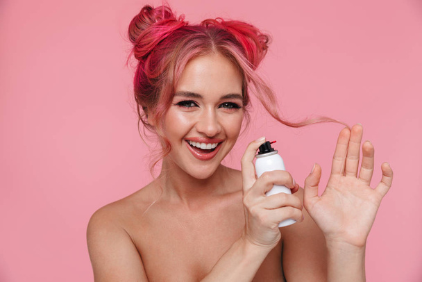 Portrait of cute shirtless young woman dying her hair with color - Photo, image