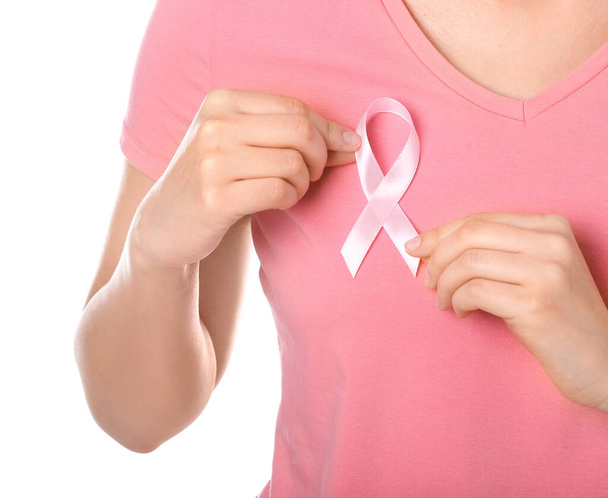 Young woman with pink ribbon on white background, closeup. Cancer awareness concept - Fotografie, Obrázek