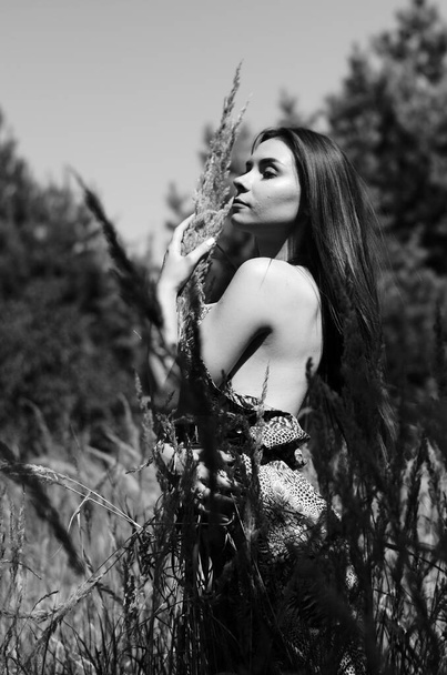 Portrait of an young beautiful sexy woman on the nature. - 写真・画像