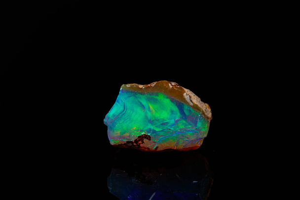 macro mineral stone rare and beautiful opals on a black backgrou - Fotoğraf, Görsel