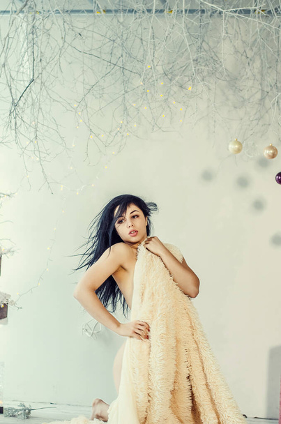 Beautiful Brunette on the Background of New Year's decoration. Fashion Beauty Portrait. Sexy Girl - 写真・画像