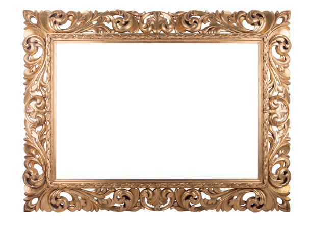 Wooden golden frame with rich woodcut ornament, isolated on white - Photo, Image