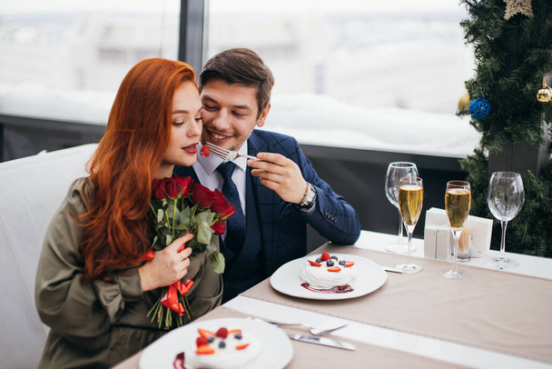 young caucasian couple celebrating saint valentines day in restaurant - Photo, image