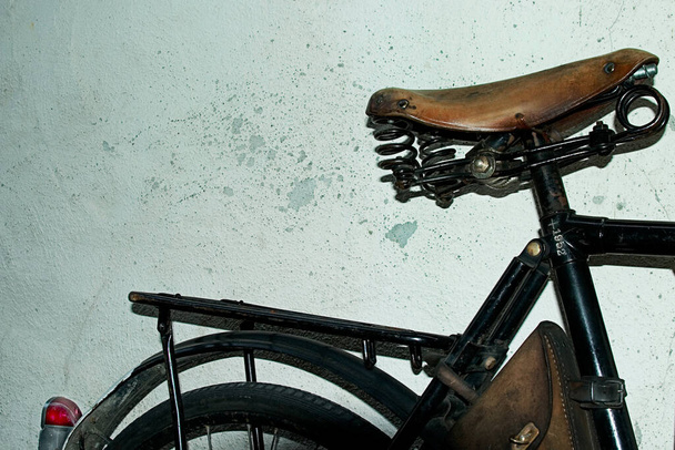 old bicycle with a vintage retro chair - 写真・画像