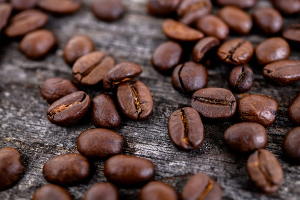 roasted coffee beans on background,close up - Foto, Imagem