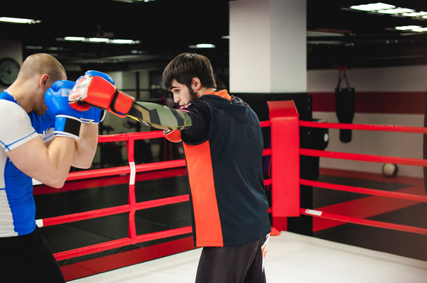 Professional Muay Thai fighters. Male boxers in training sportswear - Fotoğraf, Görsel