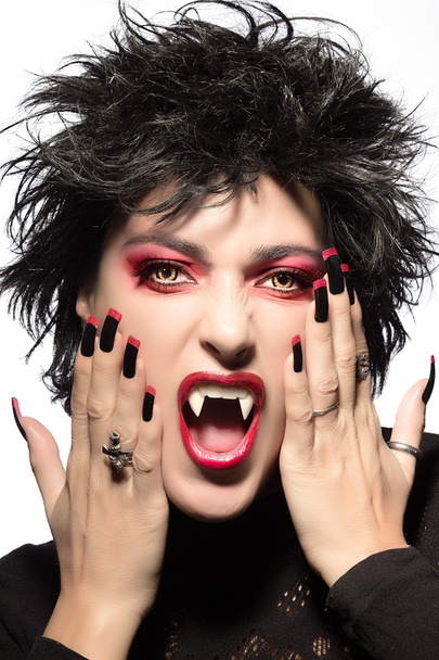 Beautiful Gothic Girl. Vampire Makeup. Halloween concept - Fotó, kép