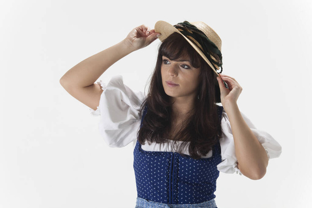 bavarian woman in a dirndl with hat - Fotografie, Obrázek