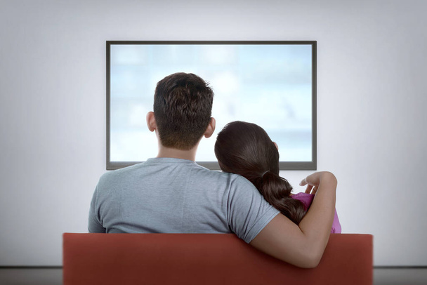 Portrait of asian couple on couch watching the television at home - Φωτογραφία, εικόνα