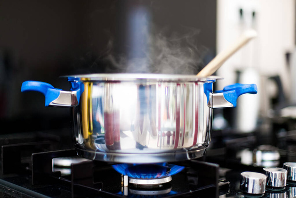 cooking pot with boiling water in the kitchen - Fotoğraf, Görsel