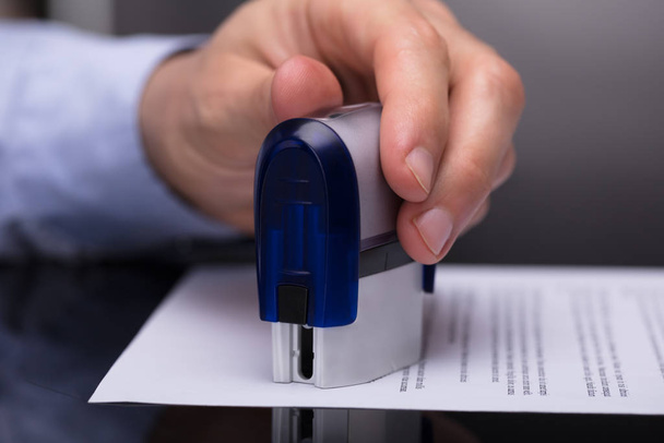 Close-up Of A Businessperson's Hand Stamping Document - Photo, Image